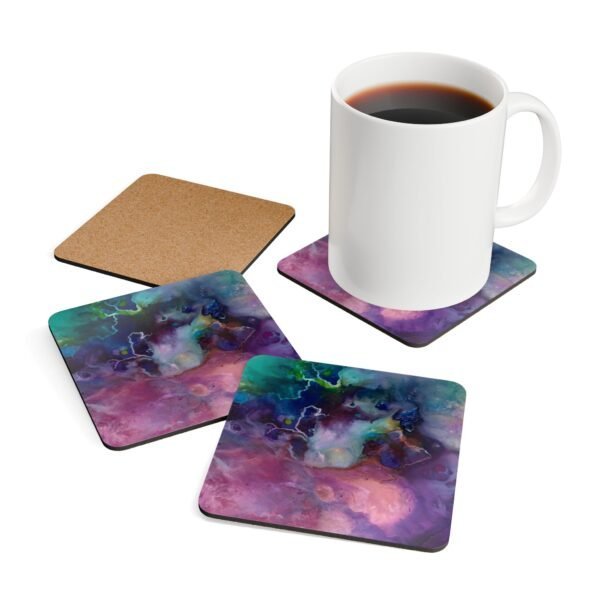 Abstract watercolor coaster set shown with coffee mug for scale.