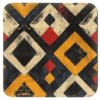 Square coaster with a geometric tribal design.