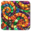 Colorful swirling mosaic glass design coaster flat on table.