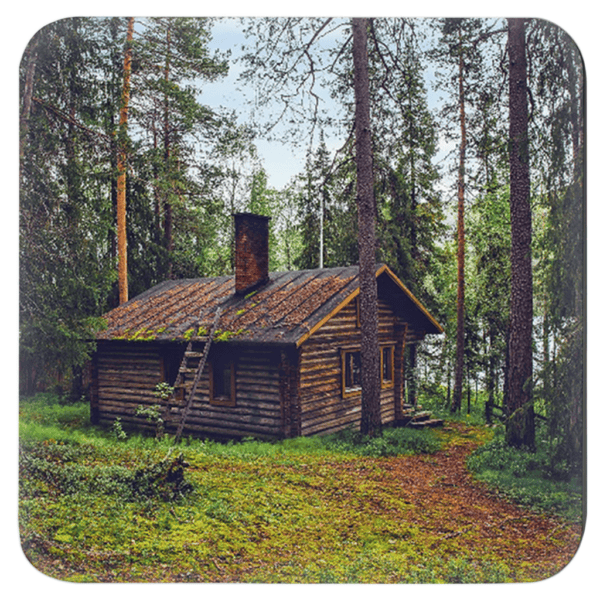 Square coaster with an image of a log cabin in a forest printed on it.
