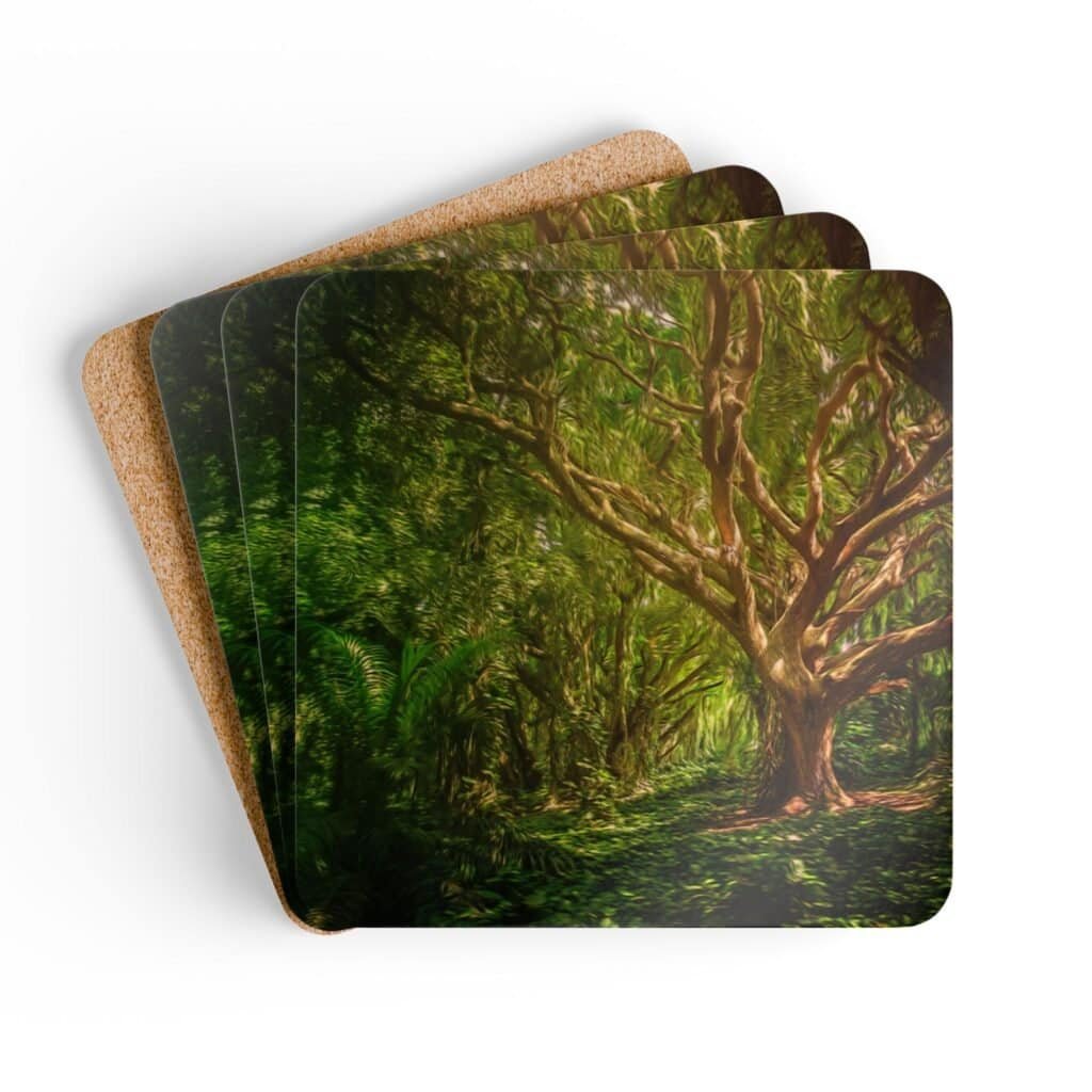Set of 4 coasters with an image of a large green tree in the forest printed on them. Shown stacked on a table.