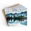 Coaster set with watercolor art print of a mountain, trees and a lake. stacked on a table.