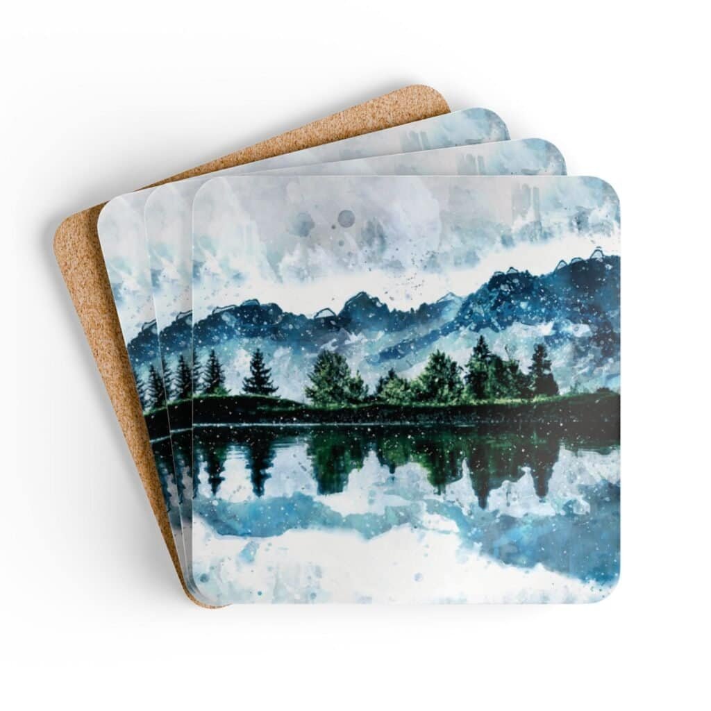 Coaster set with watercolor art print of a mountain, trees and a lake. stacked on a table.