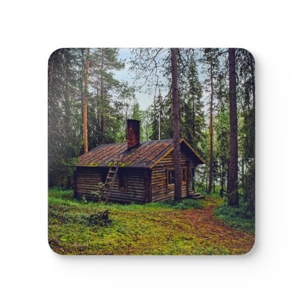 Square coaster with an image of a log cabin in a forest printed on it.