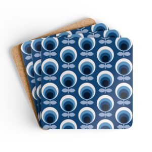 Set of 4 square coasters with a blue and white mid century modern circle print design. Shown stacked on a table.