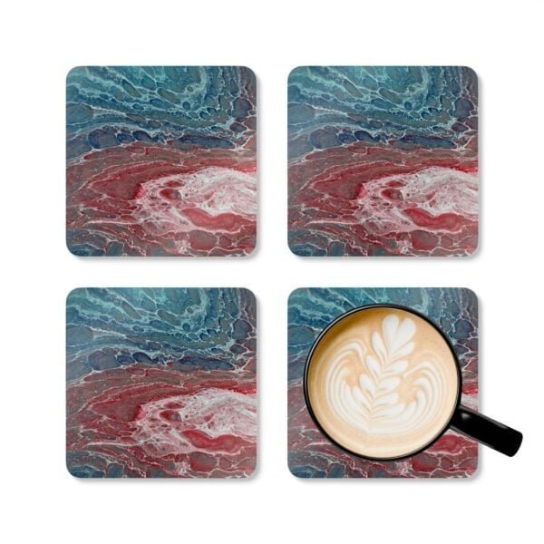 Set of 4 coasters with abstract art print in shades of turquoise blue and red. Shown with a mug for scale.