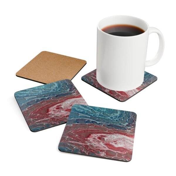 Set of 4 coasters with abstract art print in shades of turquoise blue and red. Shown with a mug for scale.