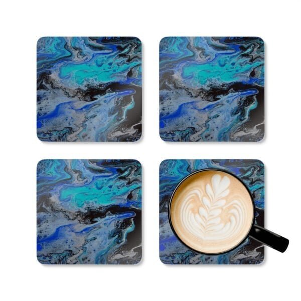 Set of 4 coasters with abstract art print in shades of turquoise blue, black and silver grey. Shown with a mug for scale.