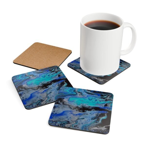 Set of 4 coasters with abstract art print in shades of turquoise blue, black and silver grey.. Shown with a mug for scale.