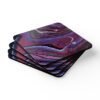 Set of 4 coasters with abstract art print in shades of red, purple, black and white. Stacked on a table.