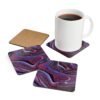 Set of 4 coasters with abstract art print in shades of red, purple, black and white. Shown with a mug for scale.