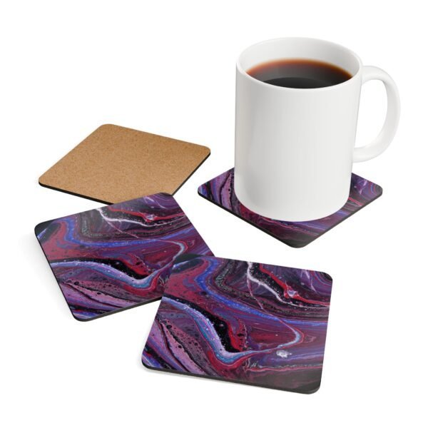 Set of 4 coasters with abstract art print in shades of red, purple, black and white. Shown with a mug for scale.