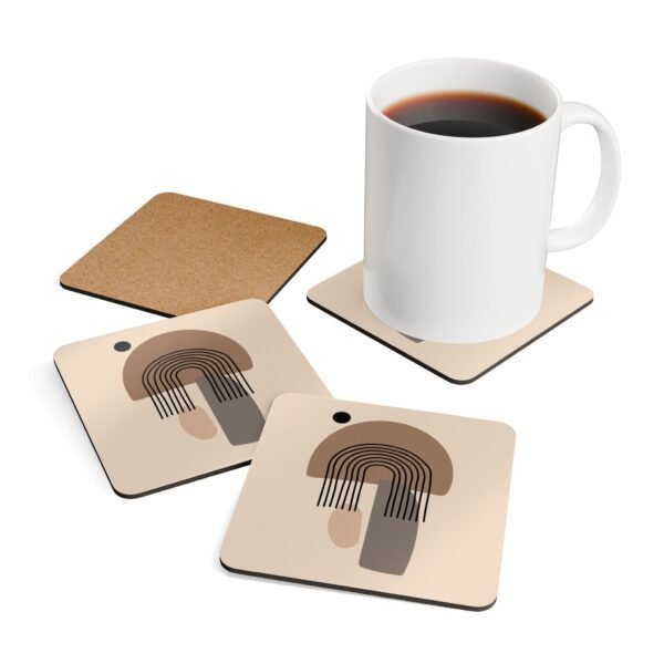 Set of four square coasters with minimalist neutral design in shades of brown, tan and black. Shown with a mug for scale.