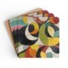 Set of 4 square coasters with colorful abstract art print image on them. Shown stacked on a table.