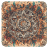 Square coaster with a watercolor style mandala in earthy tones.