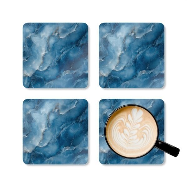 Blue and white marble print coaster set shown with mug for scale.