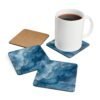 Blue and white marble print coaster set shown with mug for scale.