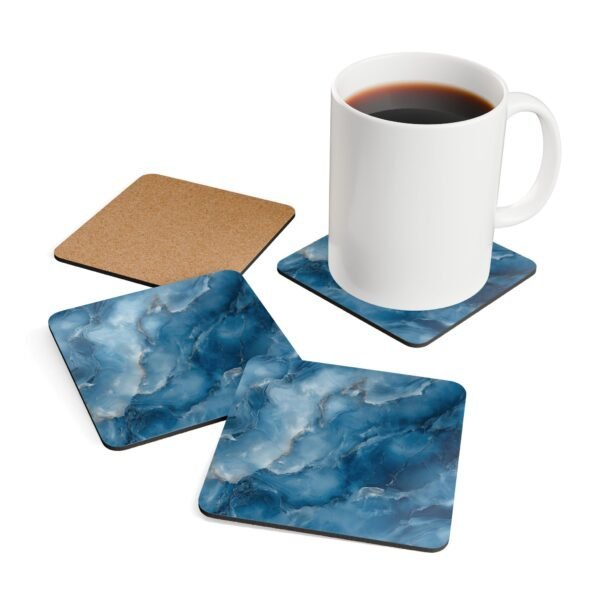Blue and white marble print coaster set shown with mug for scale.