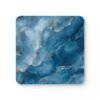 Blue and white marble print coaster flat on a table.