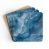 Blue and white marble print coaster set stacked on a table.