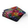 Coasters with image of colorful embroidered boho flowers stacked on a table.