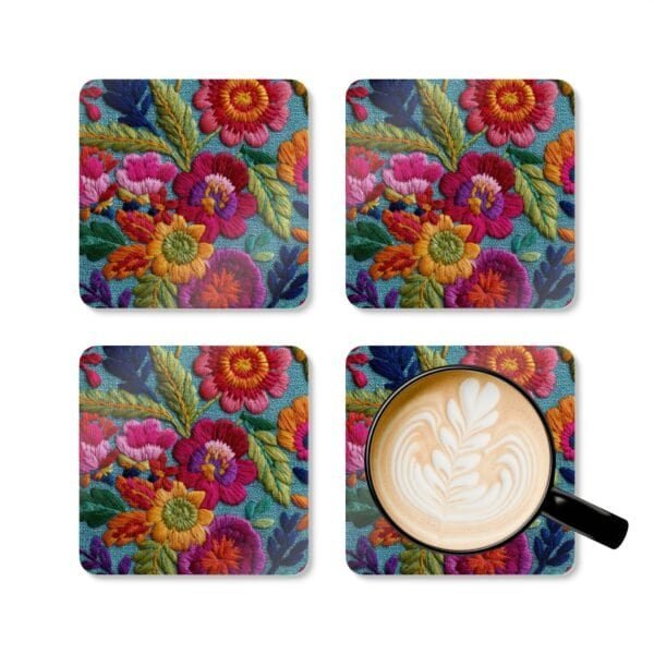 Coasters with image of colorful embroidered boho flowers shown with a mug for scale.