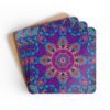 Colorful radiant mandala coasters shown stacked on a table.