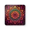 Square coaster with image of a bright hot pink, orange and yellow mandala printed on it.