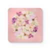 Pink watercolor floral coaster on table.