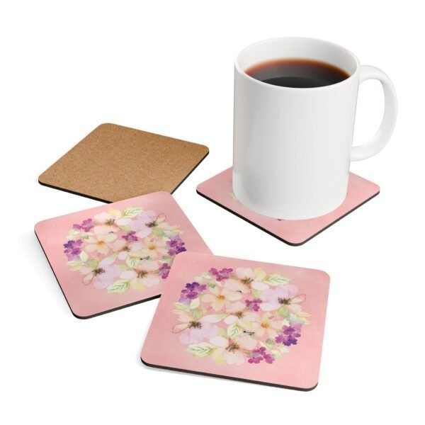 Set of 4 pink watercolor style floral coasters shown with a mug for scale.