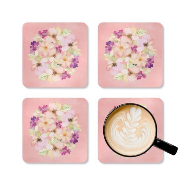 Set of 4 pink watercolor style floral coasters shown with a mug for scale.