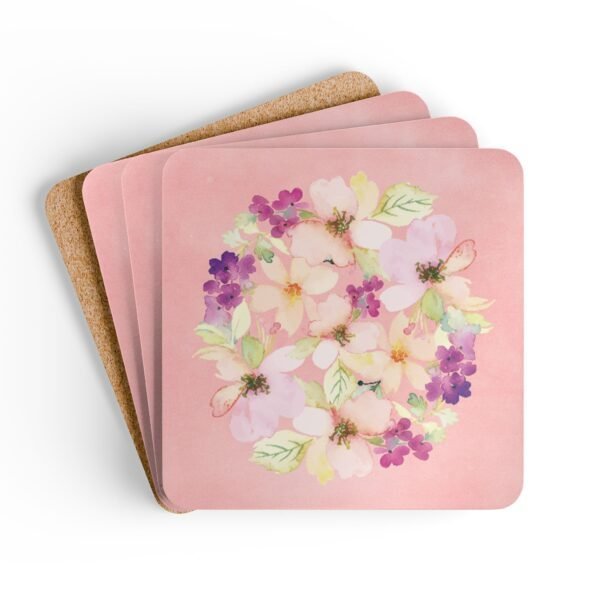 Set of 4 pink watercolor style floral coasters stacked on a table.