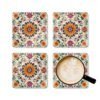 Set of coasters with a boho style floral medallion design with sunflower in the center.