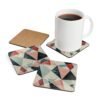 Coaster set with geometric design in triangles in red, pink, white and aqua colors.