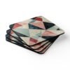 Coaster set with geometric design in triangles in red, pink, white and aqua colors.