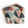 Coaster set with geometric design in triangles in red, pink, white and aqua colors.