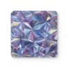 Square coaster with triangle geometric design in multi colors that have a subtle holographic look printed on it.