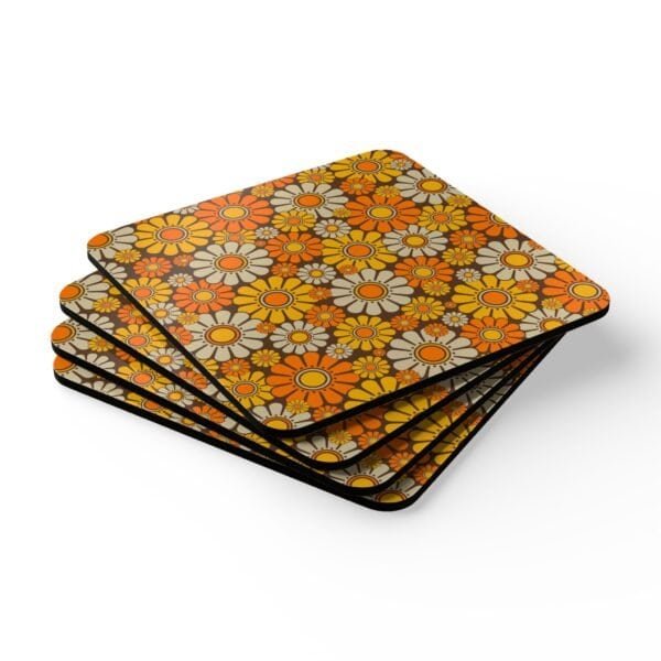 Set of 4 square coasters with 1960's hippie style daisy pattern in orange, yellow, brown and off white colors. Shown stacked on a table.