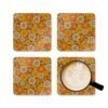 Set of 4 square coasters with 1960's hippie style daisy pattern in orange, yellow, brown and off white colors. Shown with a mug for scale.
