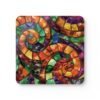Colorful swirling mosaic glass design coaster flat on table.