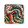 Square coaster with a mosaic design in teal, red, tan jewel tones.