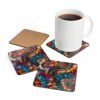 Set of 4 square coasters with a mosaic design in jewel tones. Shown with a mug for scale.