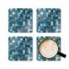 Colorful square mosaic design in shades of turquoise and teals coaster flat on table.