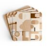 Set of four square coasters with neutral tan, beige and soft brown abstract shapes printed on them. Shown stacked on a table.