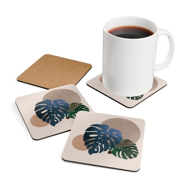 Set of four square coasters with a neutral boho design with Monstera leaves. Shown with a mug for scale.