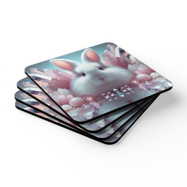 Set of four square white bunny coasters with pink crystals all around. Shown stacked on a table.