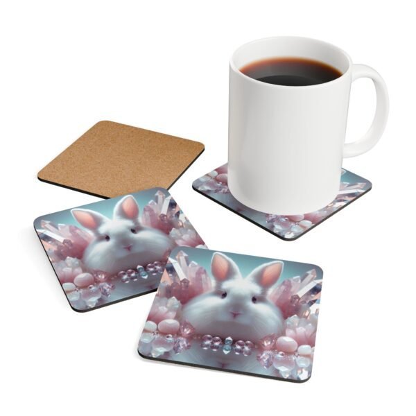 Set of four square white bunny coasters with pink crystals all around. Shown with a mug for scale.
