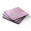 Set of 4 square coasters with image of pink mosaic tiles printed on them. Shown stacked on a table.