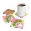 Set of four square coasters with an image of a cute white cockatoo parrot and a pink and yellow watercolor background. Shown with a mug for scale.