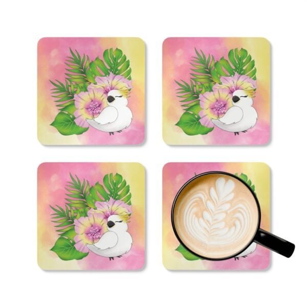 Set of four square coasters with an image of a cute white cockatoo parrot and a pink and yellow watercolor background. Shown with a mug for scale.